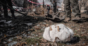 Knitted hat lying among debris in Ukrainian city