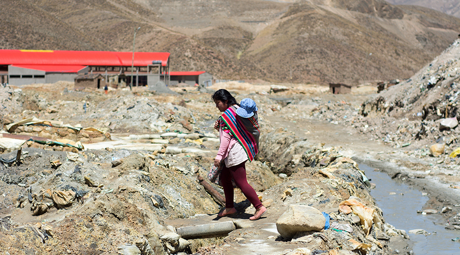 Woman with child in contaminated area in Huanuni, Bolivia